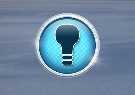 Digital composite of light bulb icon in cityの写真素材