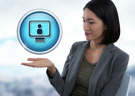 Digital composite of Computer profile icon and Businesswoman with hand palm open in city officeの写真素材