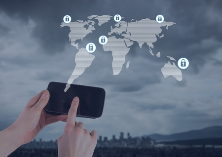Digital composite of hand holding phone over city and security lock icons connecting on map