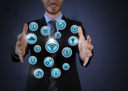Digital composite of Businessman with hands palm open and various business icons