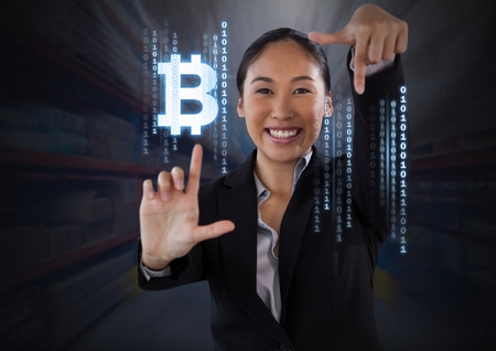 Digital composite of Businesswoman touching bitcoin graphic iconの写真素材