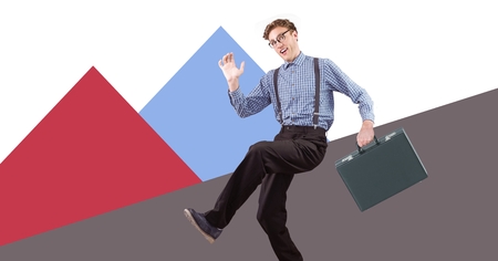 Digital composite of Businessman holding briefcase with minimal shapesの写真素材
