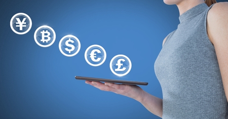 Digital composite of Currency icon bubbles and woman with tabletの写真素材
