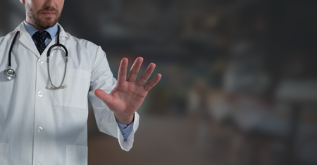 Digital composite of Doctor man holding hand openの写真素材