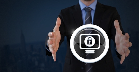Digital composite of Businessman with hands palm open and security lock icon on computerの写真素材