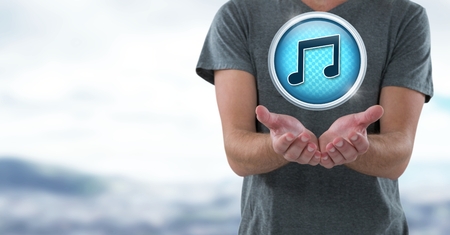 Digital composite of Music note icon and hands palm open in landscapeの写真素材