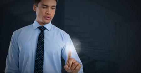 Digital composite of Businessman touching air light glowの写真素材