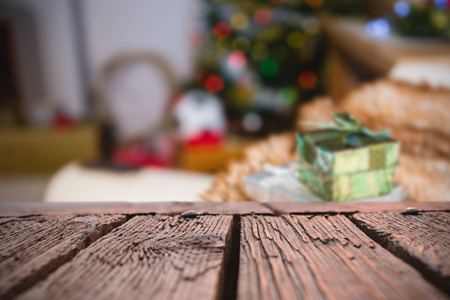 Rusty wooden plank against gifts kept on sofa at homeの写真素材