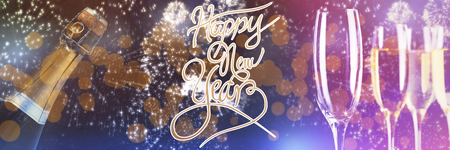 Happy New Year message against white fireworks exploding on black backgroundの写真素材