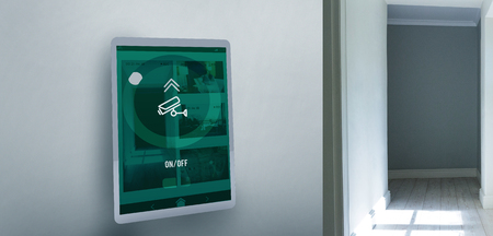 Screen of digital tablet against empty corridorの写真素材