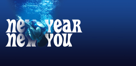 New year new you against man swimming in blue water