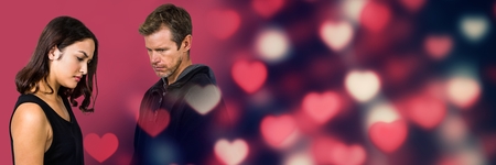 Digital composite of Sad problematic Couple with valentine's love transition heartsの写真素材