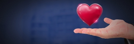 Digital composite of open hand and heartの写真素材