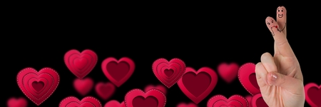 Digital composite of Valentine's fingers love couple and floating heartsの写真素材