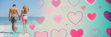 Digital composite of Couple with valentine's love transition hearts and beachの写真素材