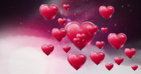 Digital composite of Shiny bubbly Valentines hearts with purple space universe misty backgroundの写真素材