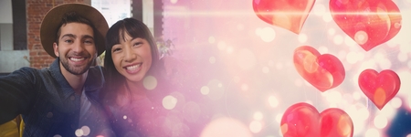 Digital composite of Couple with valentine's love transition heartsの写真素材