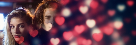 Digital composite of Cool Couple with valentine's love transition hearts glowingの写真素材