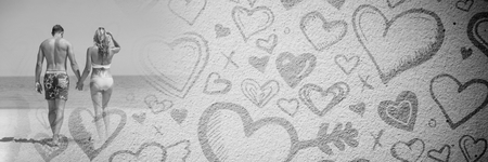 Digital composite of Couple with valentine's love transition hearts by seaの写真素材