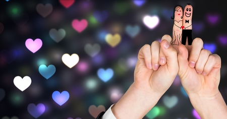 Digital composite of Valentine's fingers love couple and colorful bokeh heart lights glowingの写真素材