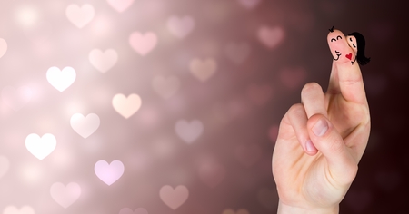Digital composite of Valentine's fingers love couple and colorful bokeh heart lightsの写真素材