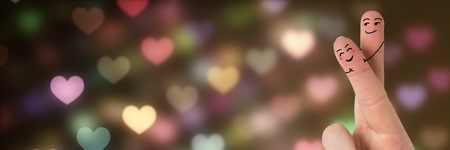 Digital composite of Valentine's fingers love couple and bokeh heart lights glowingの写真素材