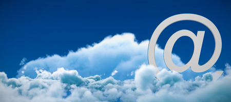 At e-mail symbol against low angle view of white clouds against skyの写真素材