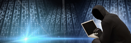 Digital composite of Anonymous hacker with computer code binary interface