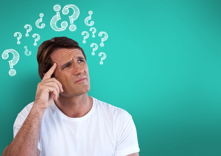 Digital composite of Confused man frowning and scratching his head looking up with question marksの写真素材