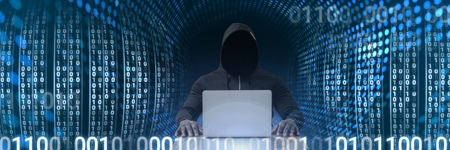 Digital composite of Anonymous hacker with computer code binary interface