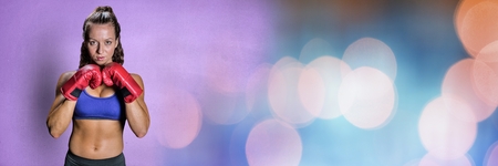 Digital composite of Boxer woman with bright bokeh lightsの写真素材