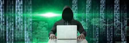 Digital composite of Anonymous hacker with computer code binary interface in city