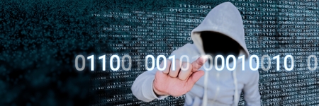 Digital composite of Anonymous hacker with computer code binary interfaceの写真素材