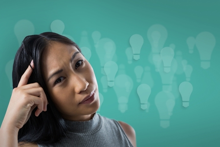 Digital composite of Woman scratching her head on a blue backgroundの写真素材