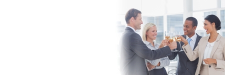 Digital composite of business people celebrating with champagne transitionの写真素材