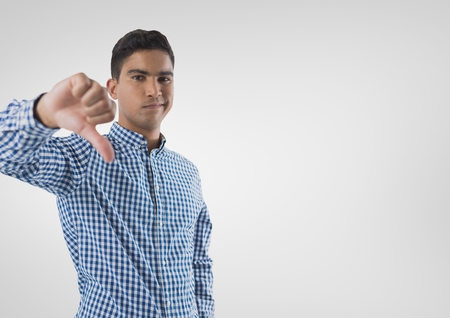 Digital composite of man in shirt  with thumbs downの写真素材