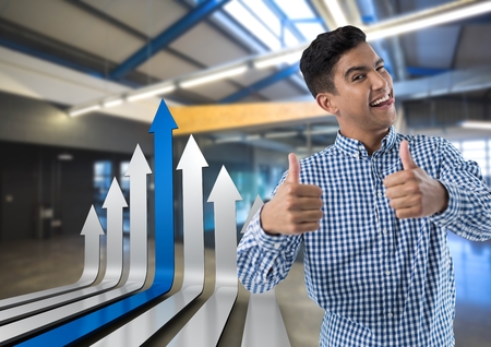 Digital composite of smiling man with arrows and thumbs upの写真素材