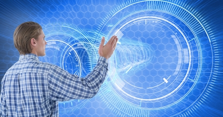 Digital composite of Man touches circle interface on wall