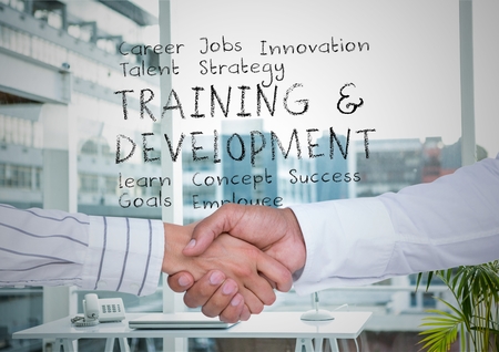Digital composite of Two men shaking hands in office with plan in text behind themの写真素材