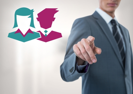 Digital composite of Businessman pointing with people iconsの写真素材