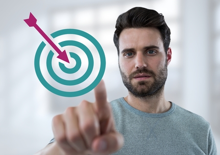 Digital composite of Hand pointing with business target and arrow iconの写真素材