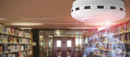 Smoke and fire detector against entrance of the college libraryの写真素材