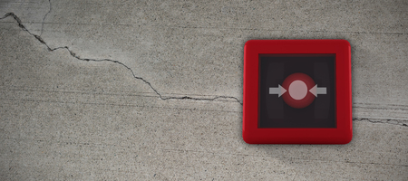 Fire alarm switch against concrete wall with crackの写真素材