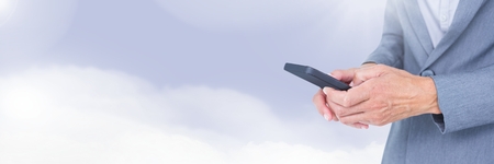 Digital composite of Businessman holding phoneの写真素材