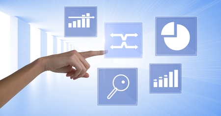 Digital composite of Hand touching business chart statistic icons