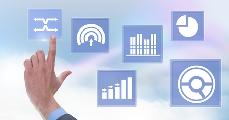 Digital composite of Hand touching business chart statistic icons