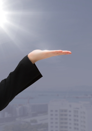 Digital composite of Hand open with grey backgroundの写真素材