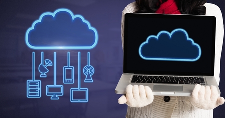 Digital composite of Hands holding laptop with cloud icon and hanging connection devices