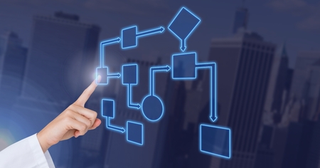 Digital composite of Hand touching wireframe with blue background