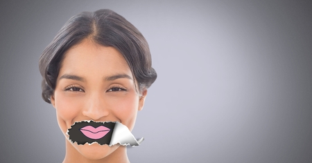 Digital composite of Woman with torn paper on mouth and lips drawingの写真素材